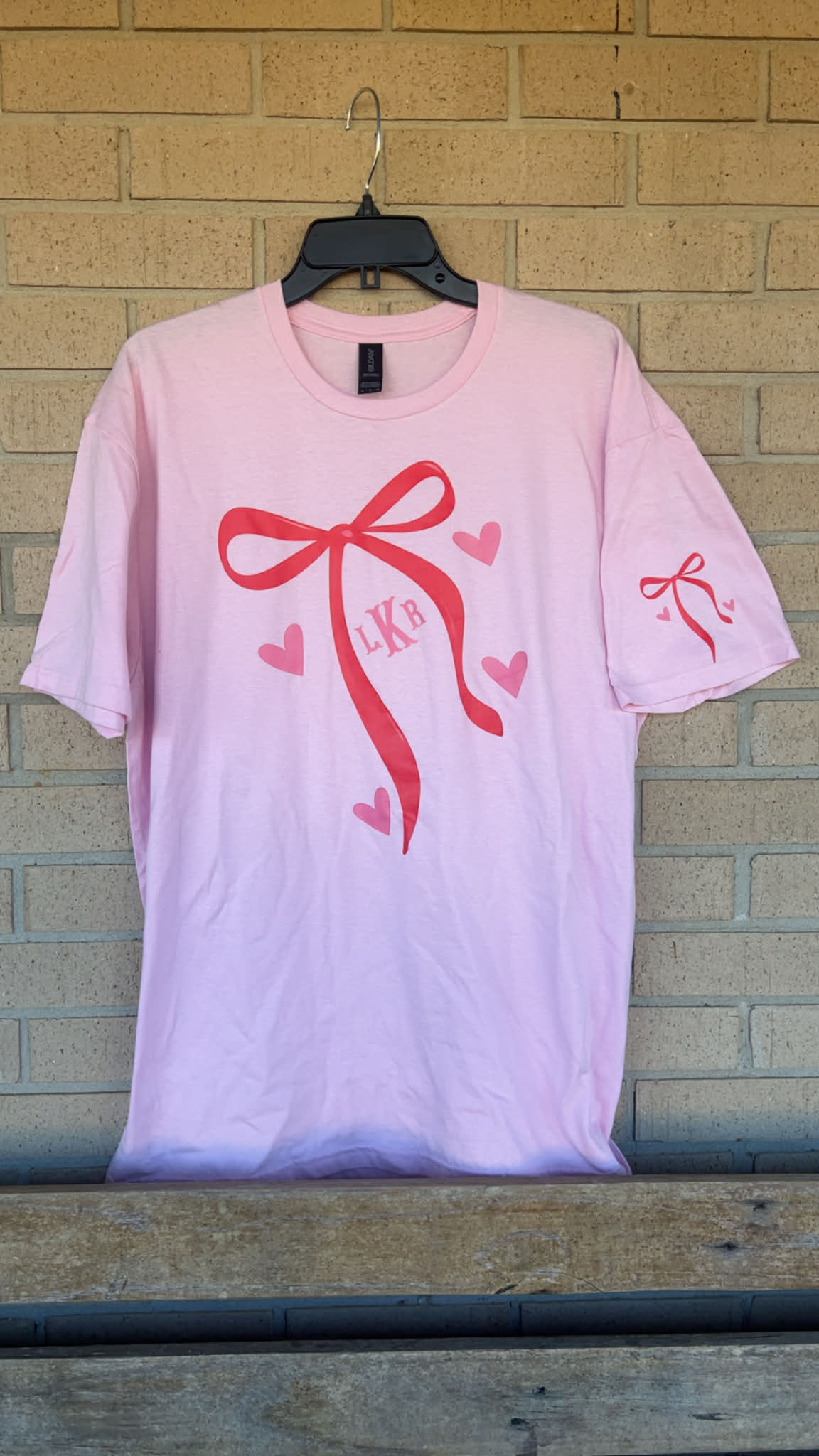 red dainty bow with monogram initial tee