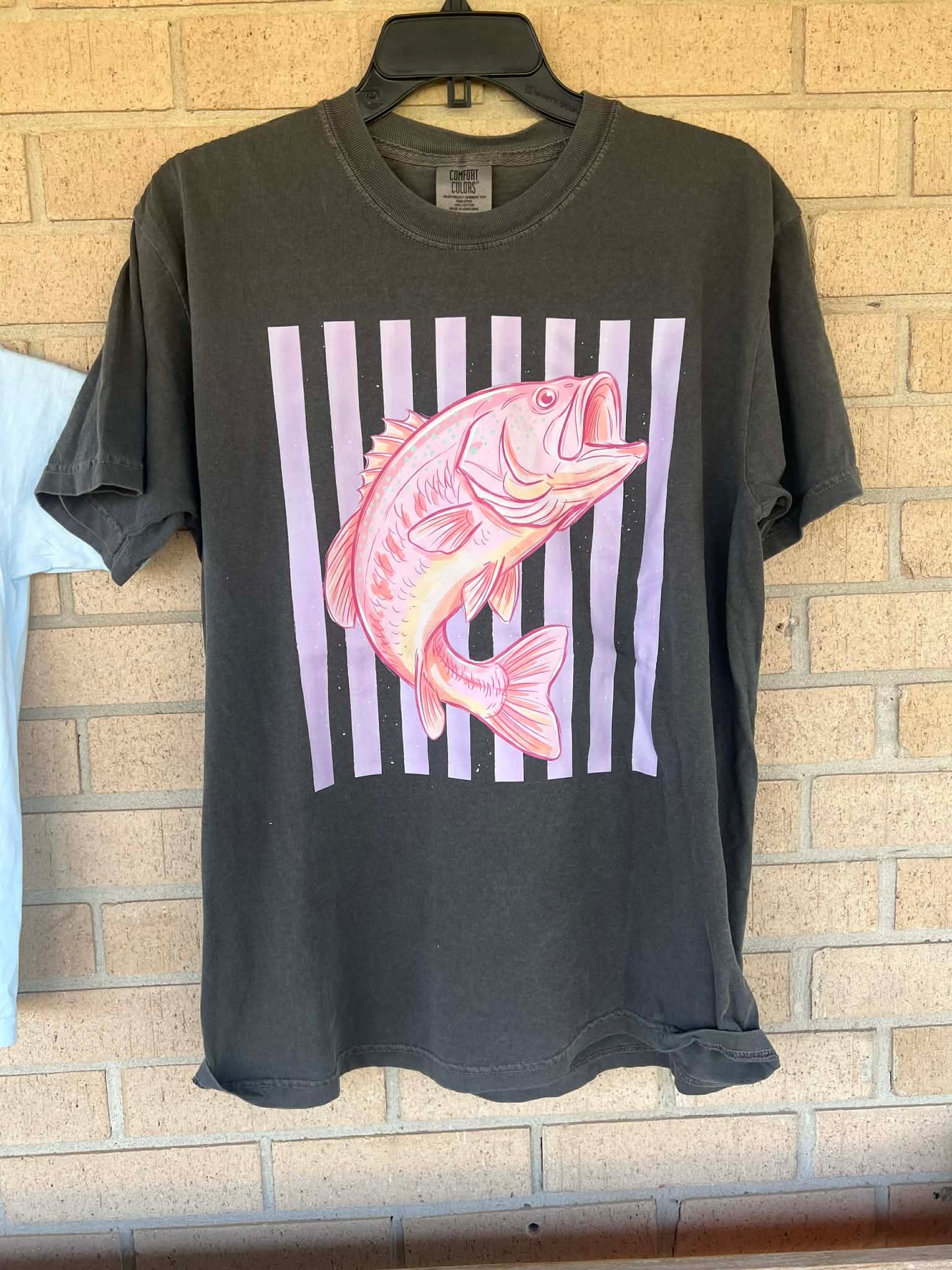 Pink bass with stripped background tee