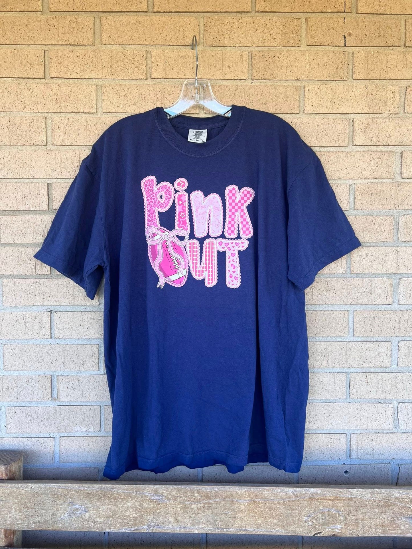 Pink out ruffle football with bow tee