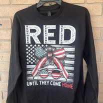 Messy bun with American flag bow wear red until they come home remember everyone deployed tee