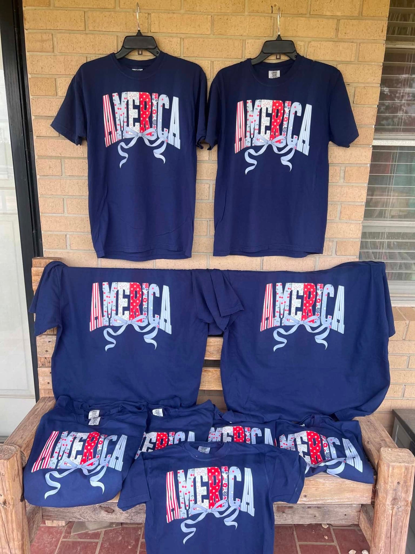 America with dainty bow tee