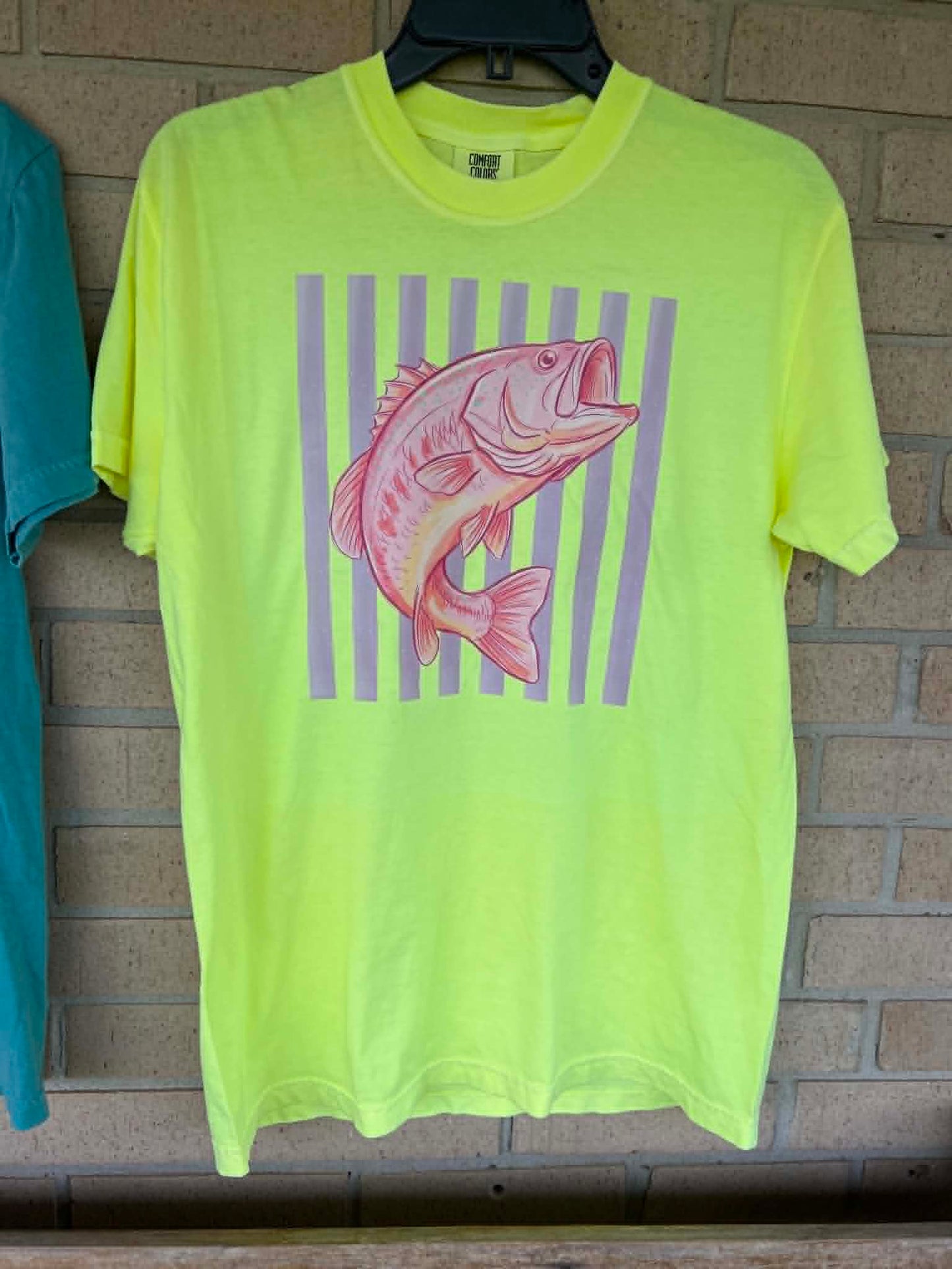 Pink bass with stripped background tee