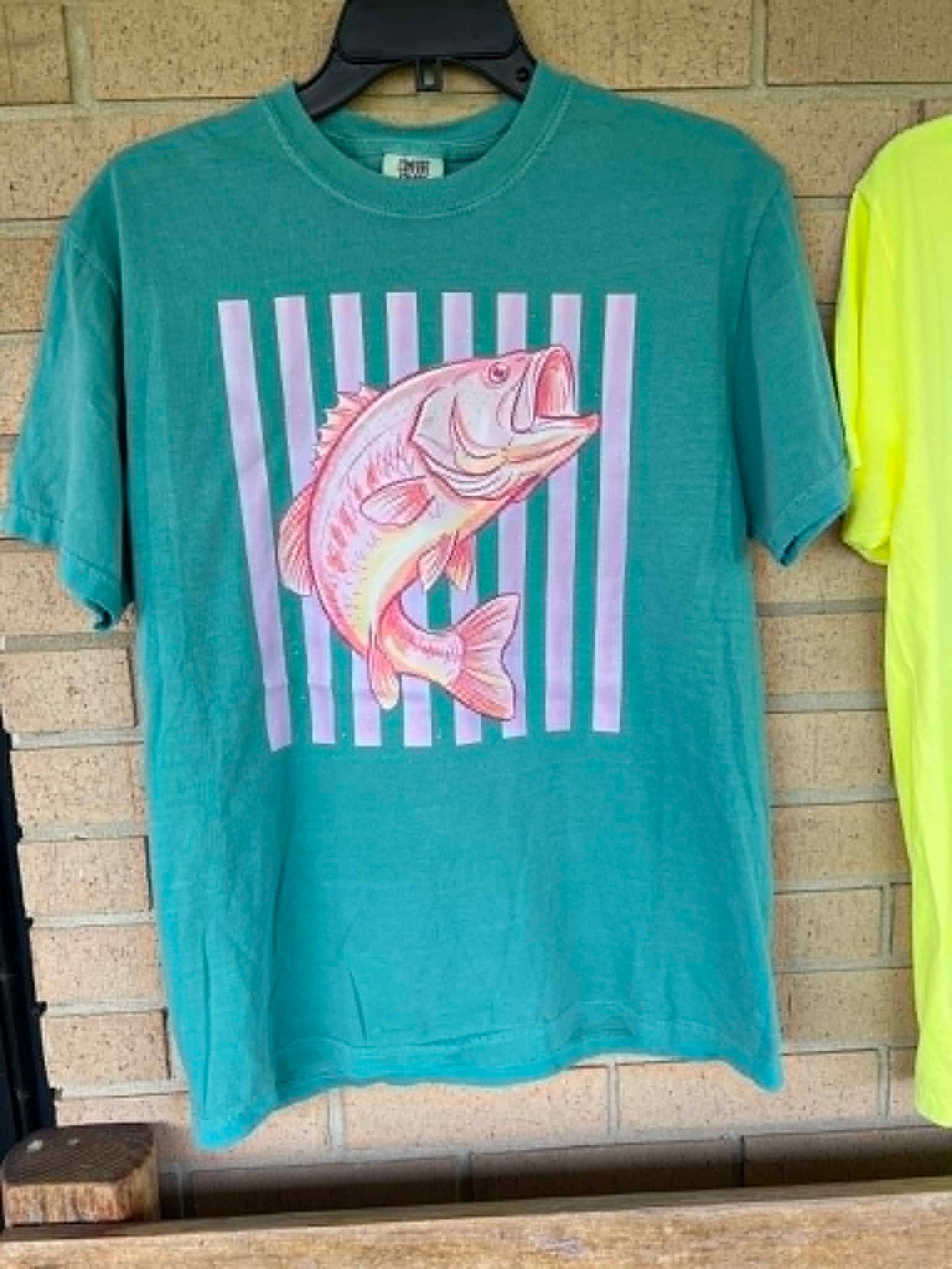 Pink bass with stripped background tee