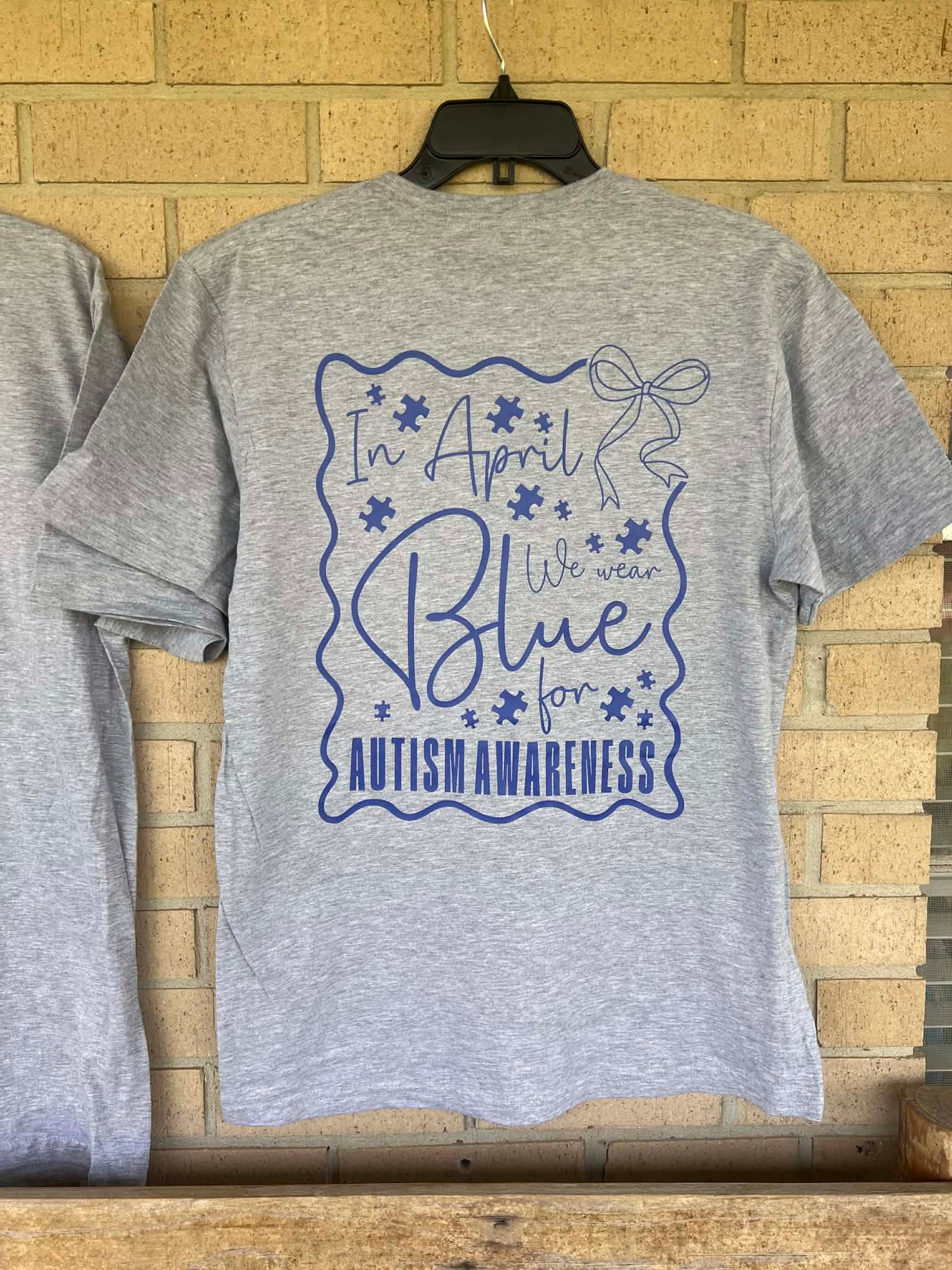 In April we wear blue dainty bow pocket tee