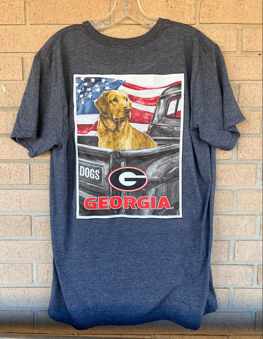Goldan retriever in back of truck with an American flag background Georgia bulldog's tee