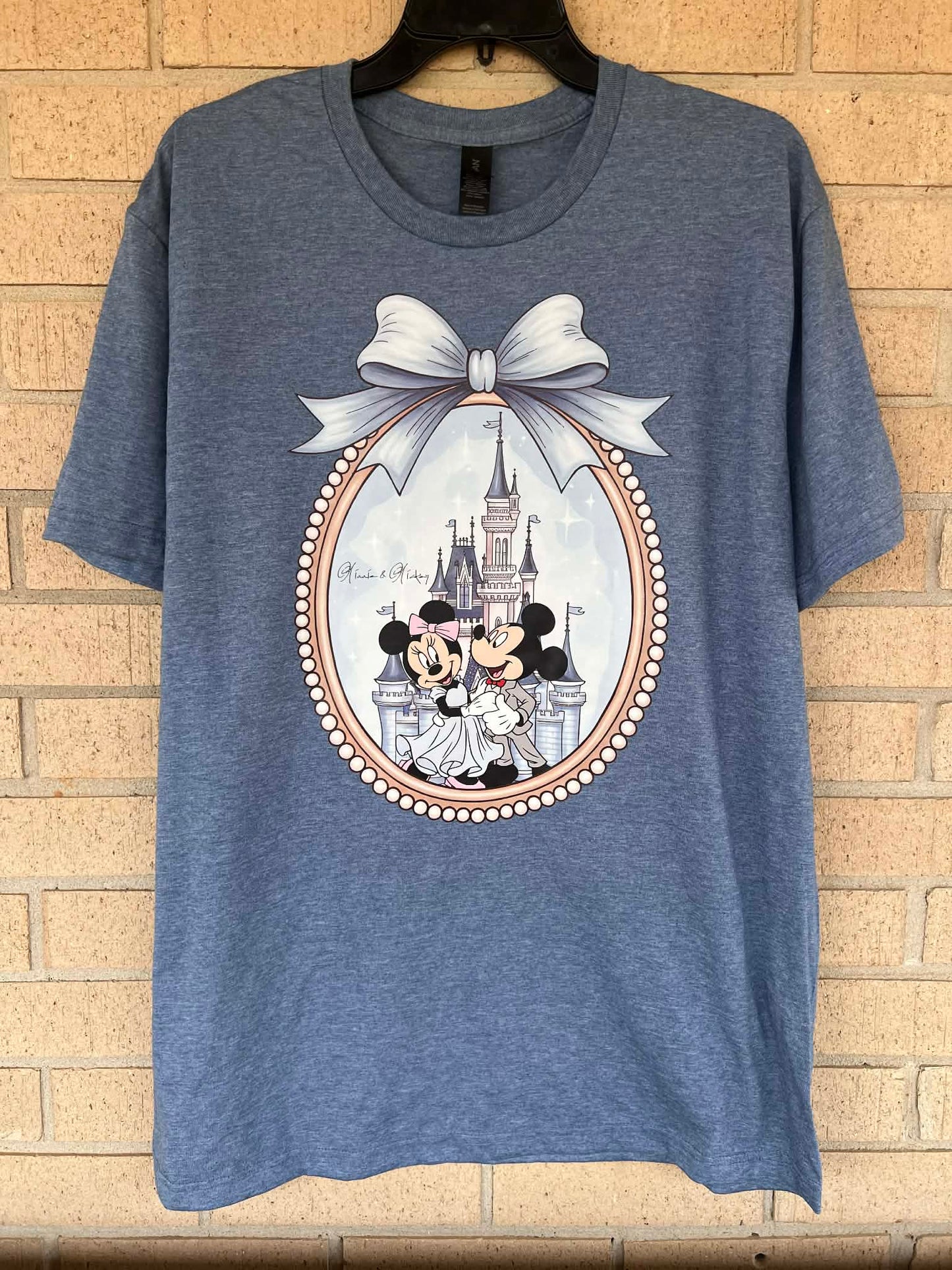 Mickey and Minnie in a mirror with Bow tee